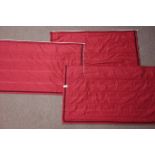 Three rectangular lined red fabric blinds,