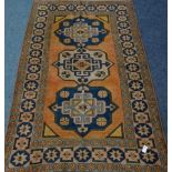 Turkish orange and blue ground rug,