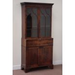 Regency mahogany secretaire bookcase, enclosed by two serpentine astragal glazed doors,