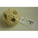 19th century Chinese Canton ivory puzzle ball carved with flower heads and foliage dia. 6.