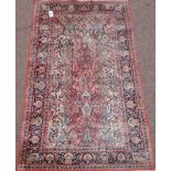 Small Persian finely knotted pink and blue ground rug,