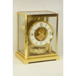 Jaeger-LeCoultre Atmos clock gilt and burnished case, white round dial with Roman numerals, W18cm,