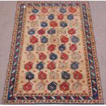 Turkish repeating Boteh design beige ground rug,