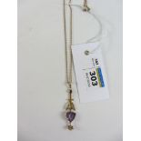 Edwardian amethyst and diamond pendant on rose gold chain stamped 9c Condition Report