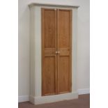 Narrow painted pine hall cupboard enclosed by two panelled pine doors with glass handles, W107cm,