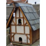 Pine and painted birdhouse with slate roof on stand H253cm Condition Report <a
