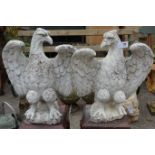 Pair composite stone eagles raised on glazed terracotta plinths Condition Report