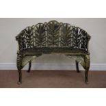 Bronzed finish heavy cast iron curved back bench, decorated with foliage and wings,