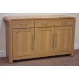 Oak finish sideboard fitted with double and single cupboard and two drawers, W131cm, H77cm,