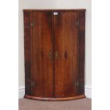 Early 19th century oak bow front wall hanging corner cabinet, W63cm,