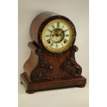 19th century mahogany and figured mahogany mantel clock fitted with decorative carved mounts,