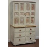 19th century rustic painted pine cupboard enclosed by two panelled doors on six drawer chest,