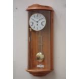 Franz Hermle German wall clock, cherry wood case enclosed by bow fronted glass door, signed,
