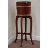 Early 20th century mahogany and brass bound barrel jardiniere and stand by 'R.A.