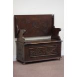 20th century carved oak monk's bench fitted with hinged seat, W108cm, H79cm,