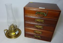 Early 20th Century walnut five drawer chest H 31 cm and a brass oil lamp Condition