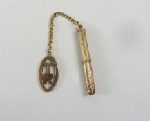Gold engine turned toothpick hallmarked 9ct with fob and chain stamped 9ct,