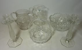 Two cut and etched glass water jugs, pair of candle sticks,