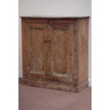 Late 19th century rustic pine cupboard enclosed by two panelled doors, W110cm, H120cm,