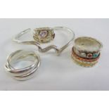 Spiral twist bangle and three heavy dress rings all stamped 925 Condition Report