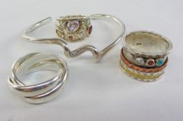 Spiral twist bangle and three heavy dress rings all stamped 925 Condition Report