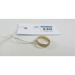 Gold wedding band with bright cut decoration hallmarked 9ct, approx 2.