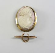 Victorian gold pink shell cameo broach stamped 9ct and a Victorian gold horse shoe broach