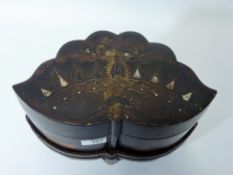 Early 20th century black lacquered Chinoiserie shell shaped box on stand with diminishing internal
