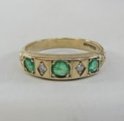 Gold emerald and diamond ring hallmarked 9ct Condition Report <a href='//www.