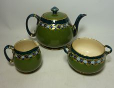 William Moorcroft Macintyre three piece tea set decorated with a border pattern from the 404017