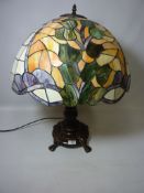 Large Tiffany style table lamp with leaded glass shade and cast metal base (This item is PAT