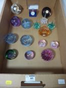 A collection of Caithness paperweights and paperweights with clock faces Condition