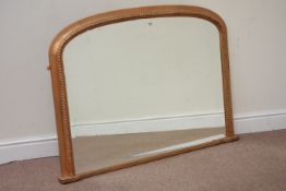 Moulded gilt wood overmantle mirror fitted with bevelled glass, W113cm,