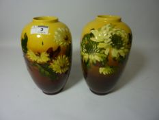 Matched pair of late 19th Century Burmantofts Faience vases with relief moulded floral decoration,