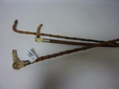 Walking cane with carved bone handle and hallmarked silver collar,
