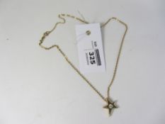 Brilliant cut South African diamond five ray gold star pendant necklace stamped 750 ( assessed