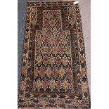 Balochi rug with Mihrab, allover geometric design, triple boarder,