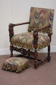 Jacobean style walnut upholstered armchair, carved lion arm supports,