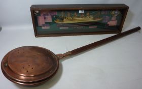 A model of the Titanic in glass display case and a Victorian copper warming pan