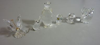 Six Swarovski crystal ornaments - a butterfly, penguin, owl, elephant,