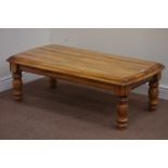 Lightwood rectangular coffee table on turned base, 119cm x 61cm,