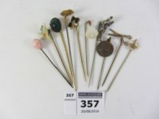 Victorian and later stick pins set with scarab beetle, articulated man, flower head,