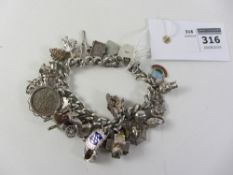 Hallmarked silver curb chain bracelet with various charms approx 2.