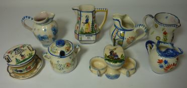 A collection of Quimper ceramics including a jam pot,