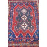Persian rug, with triple cruciform diamonds, over blue ground , various striped and floral boarders,