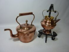 Copper kettle with wrought metal handing stand and a copper fireside kettle Condition