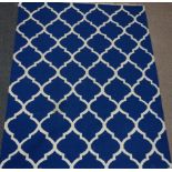 Rajasthan carpet, simple geometric design over blue ground,