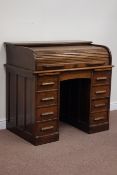 Early 20th century oak twin pedestal tambour roll top desk, fitted with eight drawers and slides,