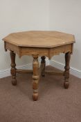 20th century oak octagonal top centre table raised on four turned legs connected by x-shaped