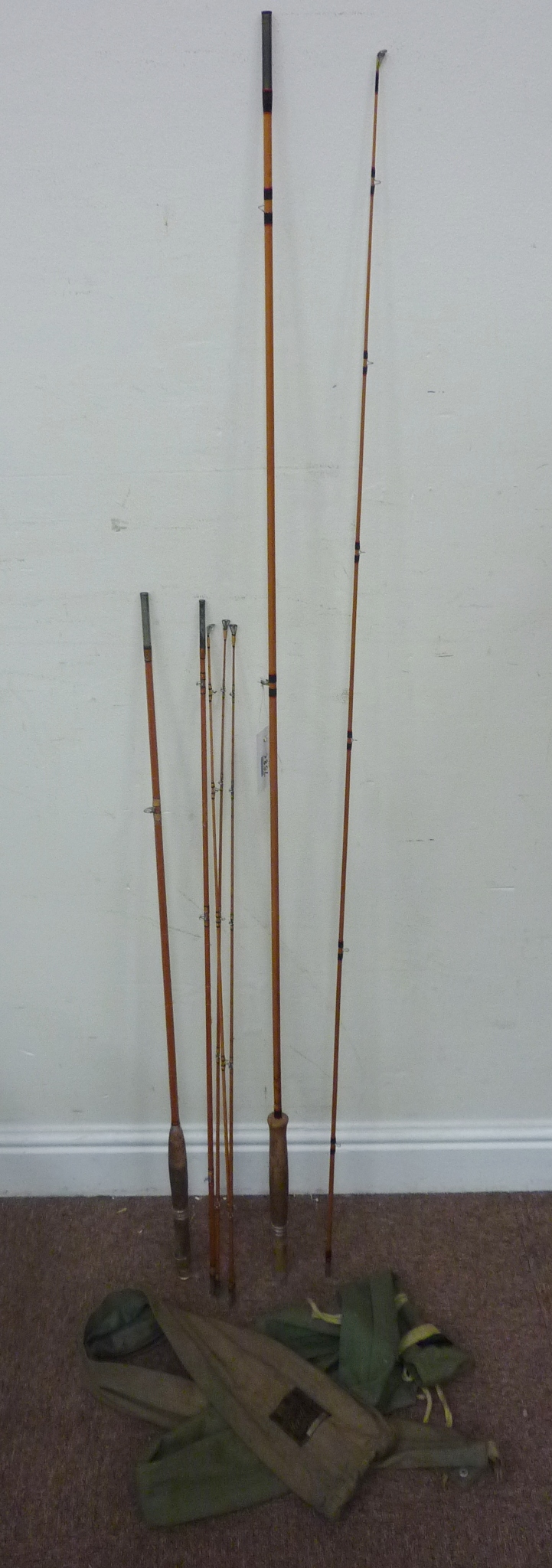 Hardy split cane 'Triumph' 8"9 two piece fly rod and a Hardy 'Hollolite' three piece split cane fly